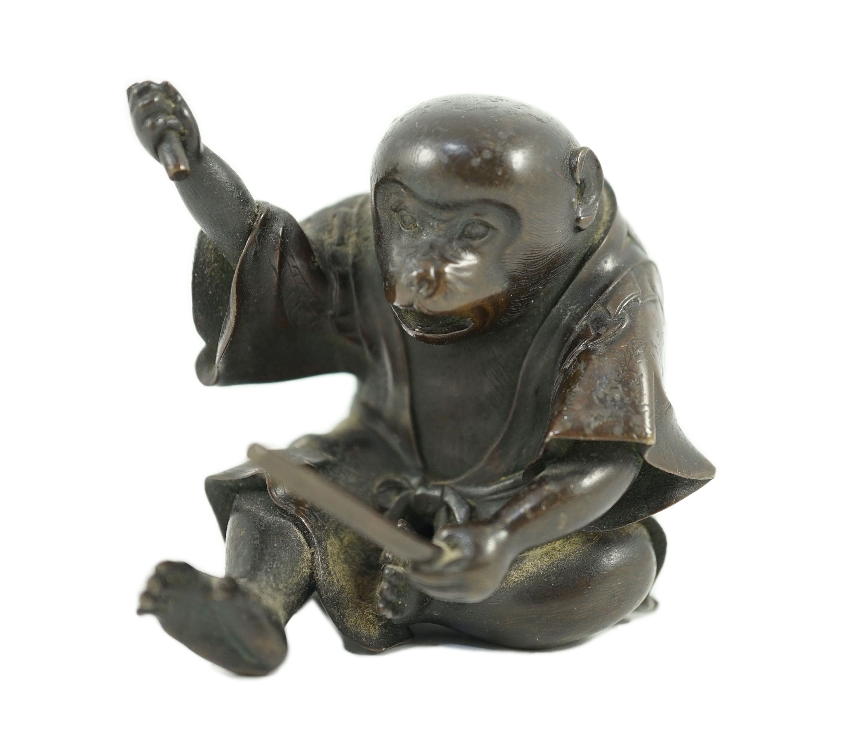 A Japanese bronze figure of a monkey, 19th century, 6cms high.